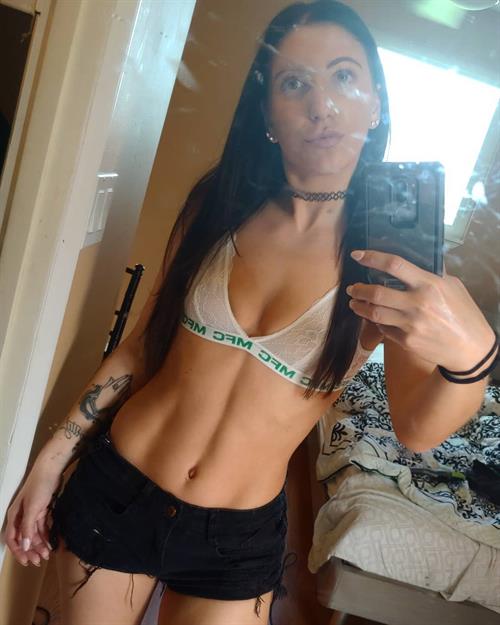 Alissa Avni in a bikini taking a selfie