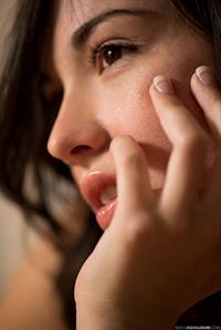 Emily Grey lifts up her dress