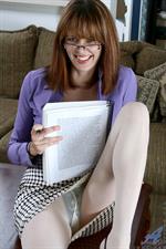 Sexy red head spreads her shaved pussy at Anilos