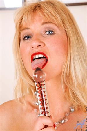 Suzy Nude Pictures Sexy blonde cougar in red lipstick fucks her pussy with the rabbit