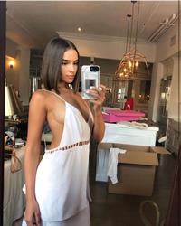 Olivia Culpo braless boobs showing nice sideboob cleavage with her big tits in a sexy little low cut top.