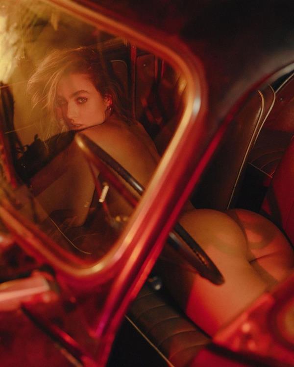 Sommer Ray nude new photoshoot in a car laying naked showing her perfect ass while holding her bg tits when she sat up.