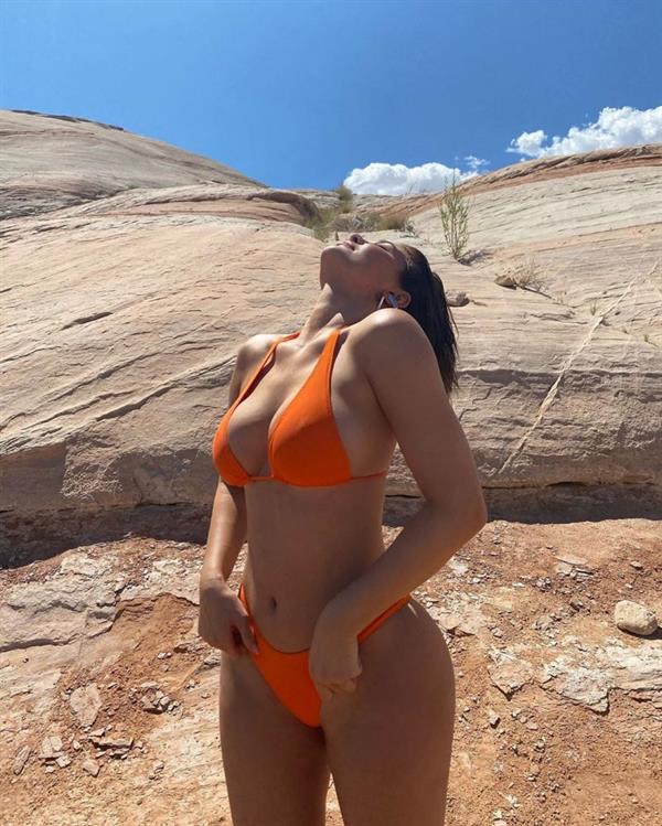 Kylie Jenner new vacation photos in a sexy orange thong bikini showing nice cleavage with her big tits.