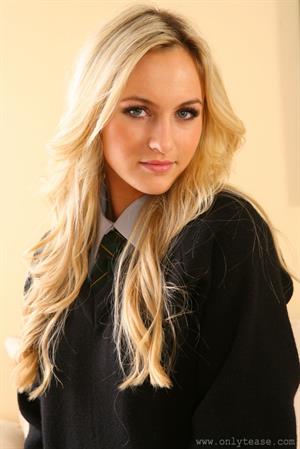 Natasha Anastasia Nude Pictures Blonde strips out of her college uniform in the lounge.