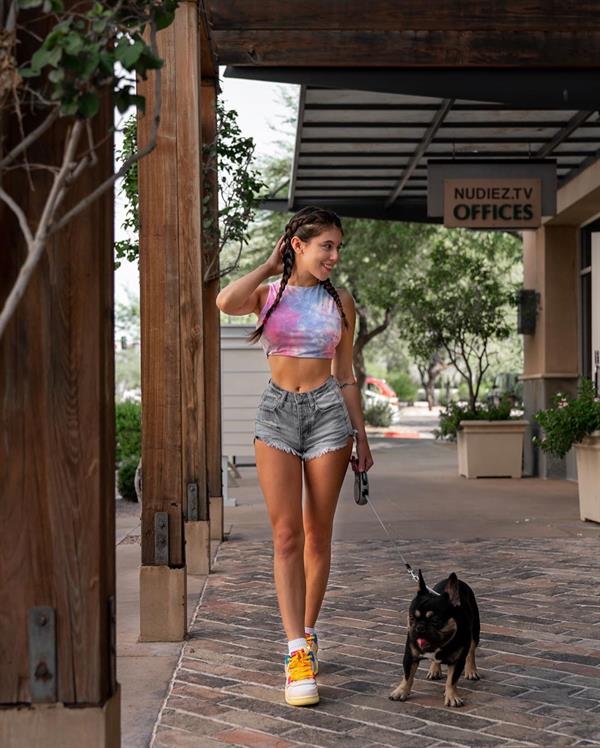 Violet Summers walking her little doggy
