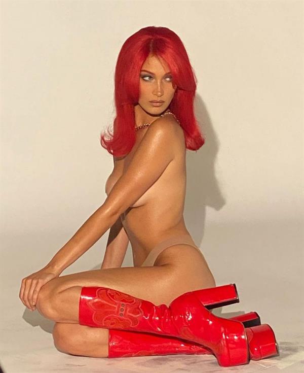 Bella Hadid topless boobs new photoshoot with red hair and red boots with nude color panties barely covering her tits.