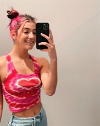 Charli D’Amelio braless boobs in a sexy little colorful tank top showing off her tits pokies and abs.