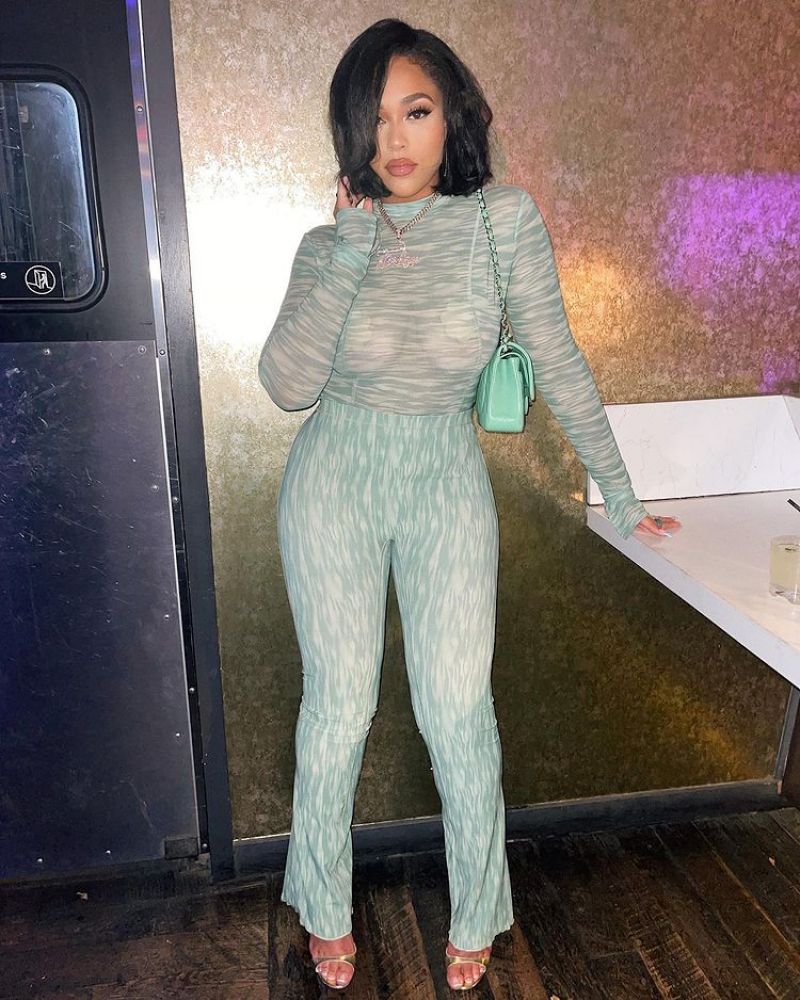 Jordyn Woods braless boobs in a see through outfit showing off her big tits with pasties on her nipples.