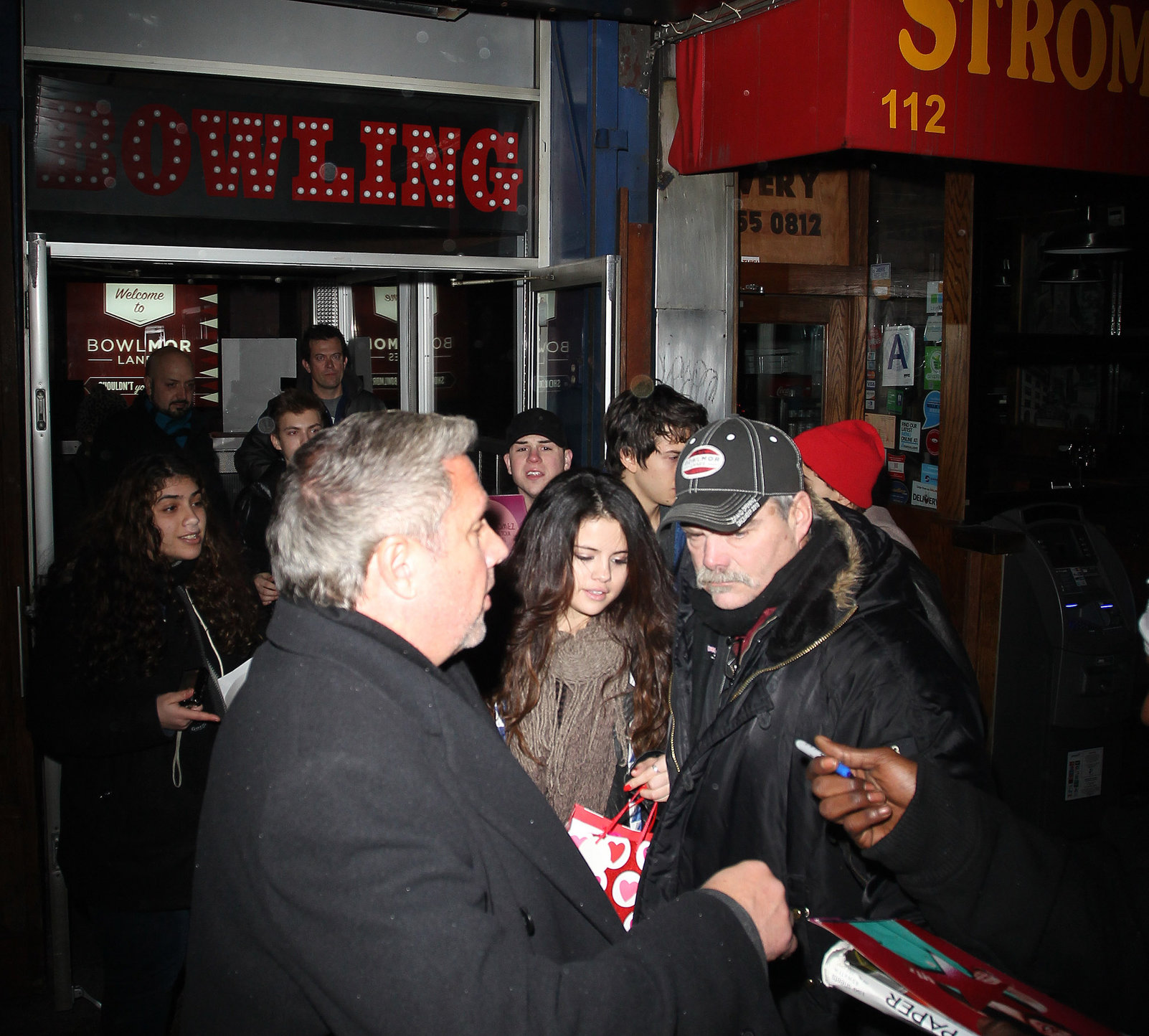 Selena Gomez surrounded by fans for autographs in New York City on February 5, 2013