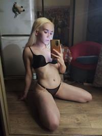 Nastya Uzinger in lingerie taking a selfie