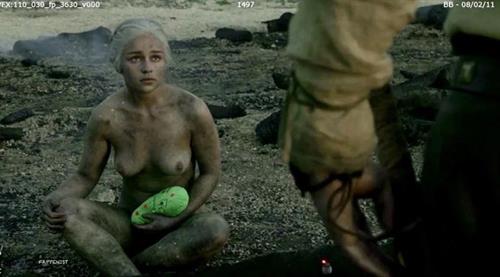 Emilia Clarke nude boobs behind the scenes screenshot from the series  Game Of Thrones  showing off her topless big tits sitting naked.
