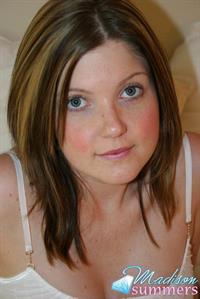 Madison Summers strips down on a white bed