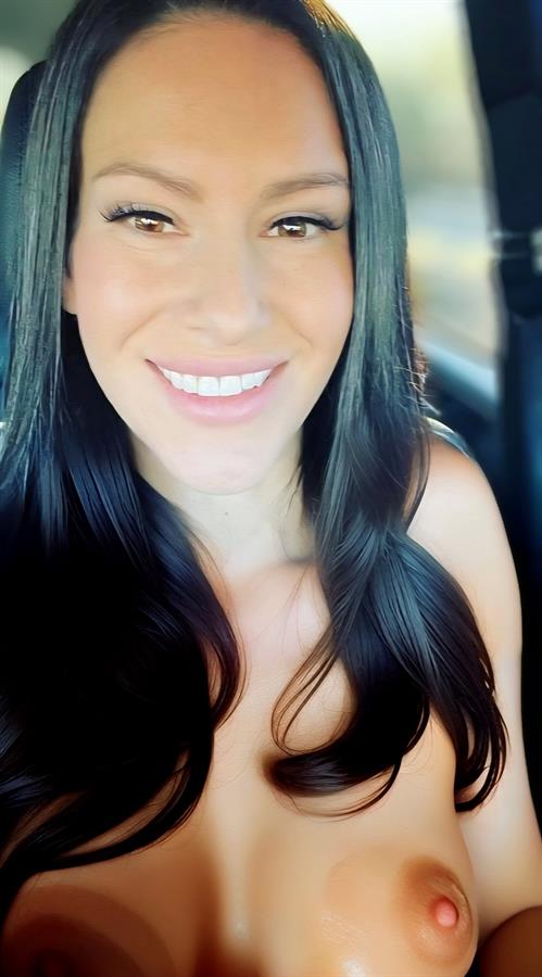 Laura Vincent taking a selfie and - breasts