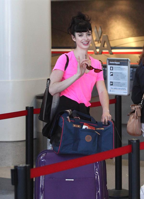 Krysten Ritter - Prepares to leave LAX in Los Angeles, California - June 8, 2012 