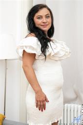 Looking like a dream come true in her white dress Christina Santes is happy to show you that her bra and thong beneath are just as white and lovely.