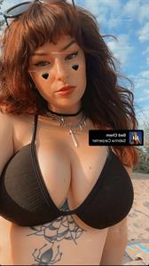 Tessi in a bikini taking a selfie