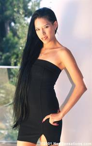 Long haired brunette girl poses & sucks cock