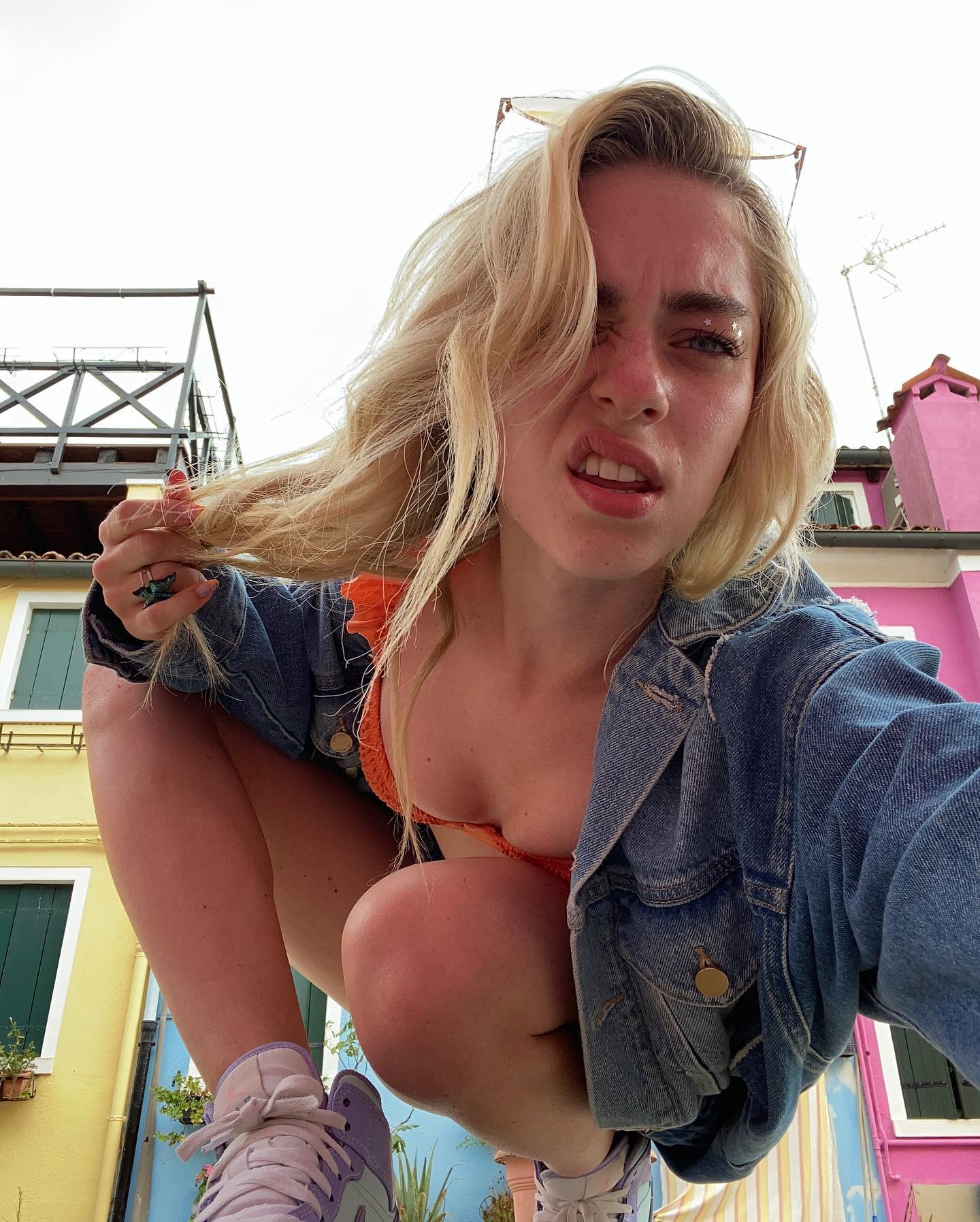 Camille Dhont in a bikini taking a selfie