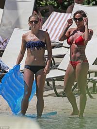 Alex Morgan and Sydney Leroux in bikinis on the beach in Hawaii